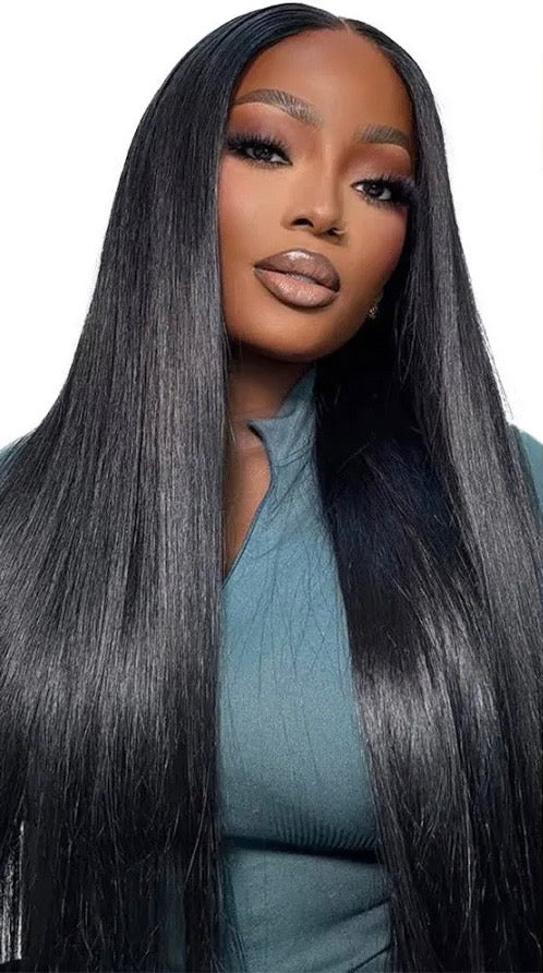 Woman with long premium virgin human hair straight black 1 and 1b hair wearing a teal top on a white background near Arlanta at Best Sew In Atlanta 